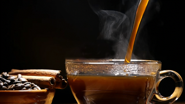 coffee pouring into glass cup